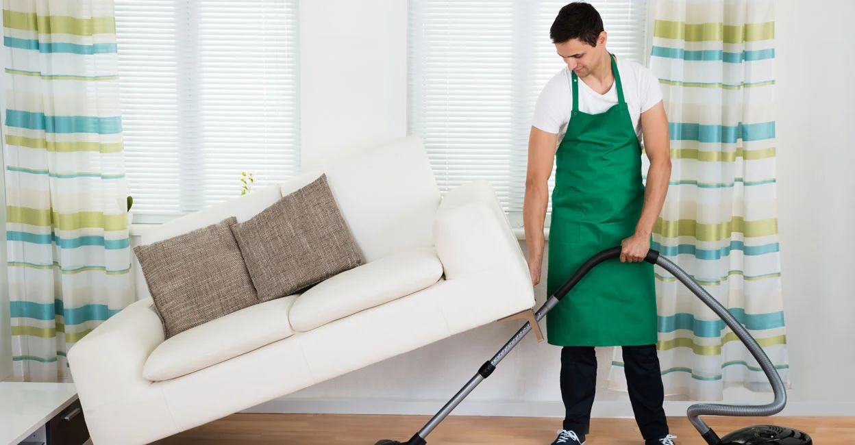 Male house helper organising household tasks